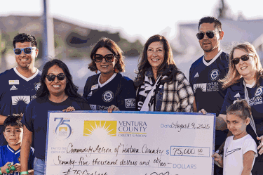 Staff presenting $75,000 donation check