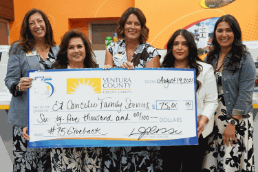 Staff with $75,000 donation check