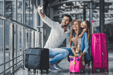 Holiday tips rides Family taking selfie at airport